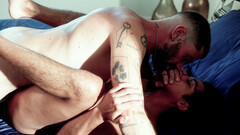 Tattooed man with a hairy body banging a submissive fella
