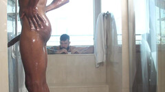 Tattoeod stud and a black bodybuilder are getting wet