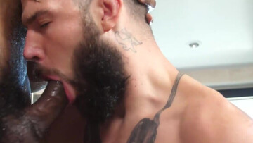 Tattoeod stud and a black bodybuilder are getting wet