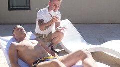 Pool lad with a great body gives a handjob to a stud