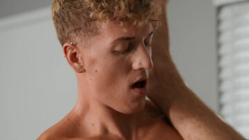 Curly-haired twink gives a blowjob and gets penetrated