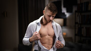 Young lovers fuck on the leather couch in intriguing gay kinks