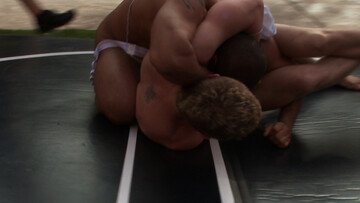 Wrestling match in the back of the house for two men