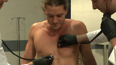 Kip Johnson is oiled up and used by two horny doctors