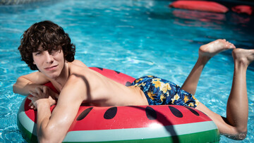 Sunbathing and trying big dicks in the ass is what makes this twink happy