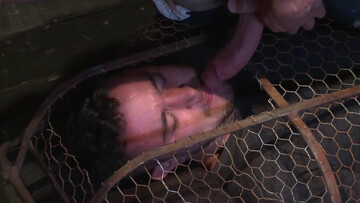 Muscular man is tied up and caged by a sadistic pervert