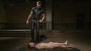 Wearing a leather outfit and having fun with a ginger lad