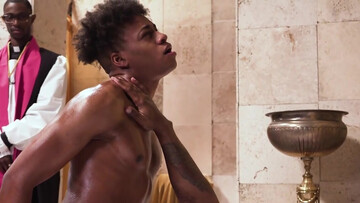 Baptism for a young pervert in front of an older priest