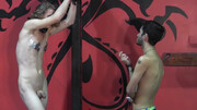 Submissive lad with long hair is tied and gets teased