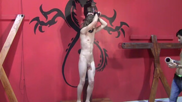 Submissive lad with long hair is tied and gets teased