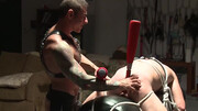 Using a baseball bat to tease the body and teh ass of a sub