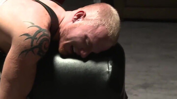 Using a baseball bat to tease the body and teh ass of a sub