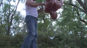 Hanging upside down in the middle of the park after working out