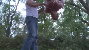 Hanging upside down in the middle of the park after working out