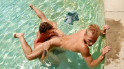 Outdoor sensations by the pool makes the lovers play slutty