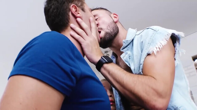 Blonde watches as the two muscular men suck and fuck