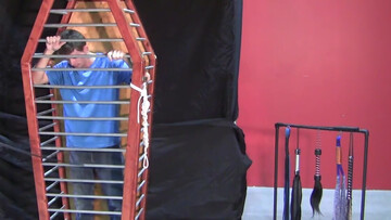 Caged boy is eager to experience his first maledom experience