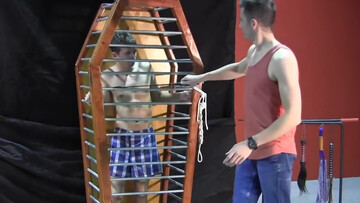 Caged boy is eager to experience his first maledom experience