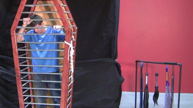 Caged boy is eager to experience his first maledom experience