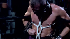 Chained male with stunning forms endures rough sexual punishments