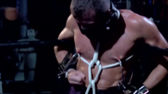 Chained male with stunning forms endures rough sexual punishments