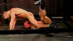 Muscular bear ass fucks his slave while the guy is being chained