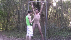 Skinny boy gets tied up to a tree and seduced in bondage perversions