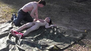 Submissive lad is tied up in the middle of nowhere