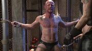 Bald male slave gets roughly treated during bondage maledom scenes