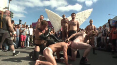 Submissive man lets his masters take advantage of him in public