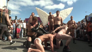 Submissive man lets his masters take advantage of him in public