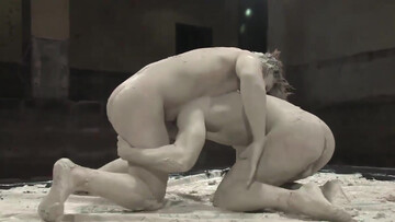 Wrestling on the mat and getting muddy right after