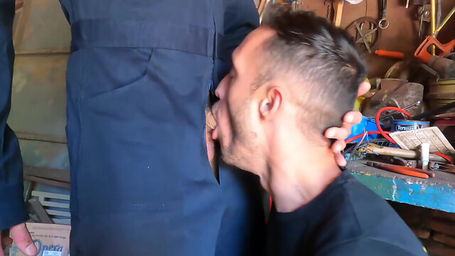 Sexy mechanic sticks the dick in the guy's mouth and fucks him like a bull